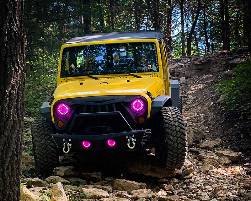 Yellow jeep with pink headlights